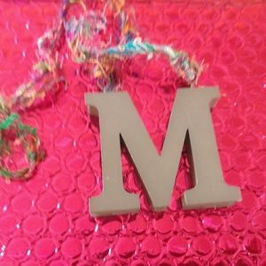 M necklace on colorful yarn from Holland